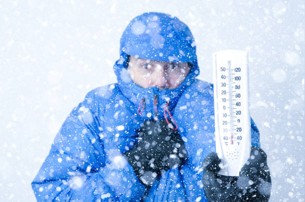 Portrait of man freezing under snowfall