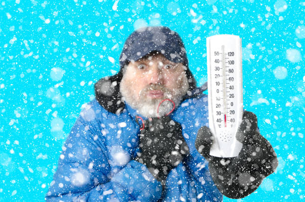 istock Portrait of man freezing under snowfall 1285334402
