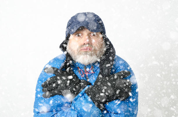 istock Portrait of man freezing under snowfall 1285334462