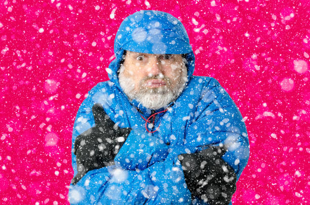 istock Portrait of man freezing under snowfall 1285334616