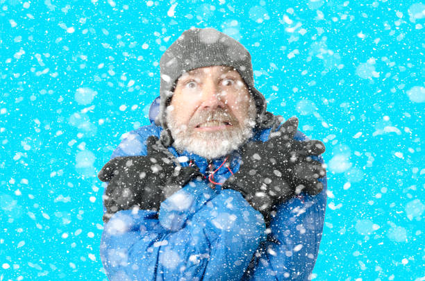 istock Portrait of man freezing under snowfall 1285334653