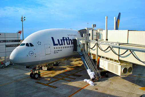 Orlando, Florida, USA - November 05, 2016: Preparing a Lufthansa Airbus A380-800 aircraft ready for a flight using a passenger boarding bridge