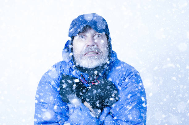 istock Portrait of man freezing under snowfall 1285334664