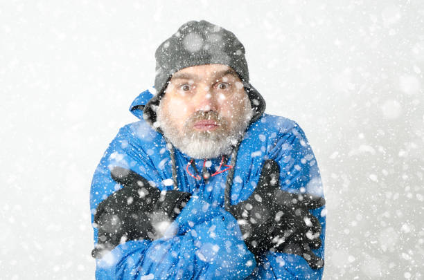 istock Portrait of man freezing under snowfall 1285334699