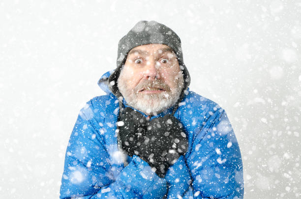 istock Portrait of man freezing under snowfall 1285334716