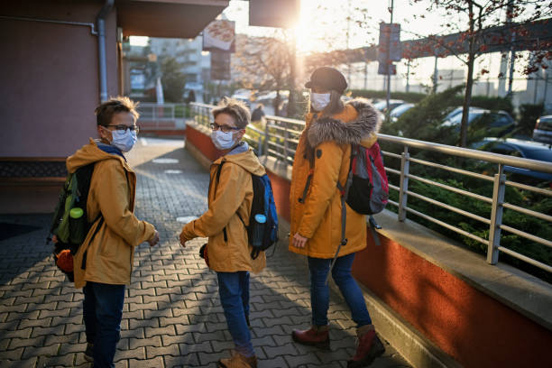 istock Kids going to school walking during COVID-19 pandemic 1285334875