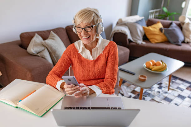 istock Working senior woman at home 1285335463