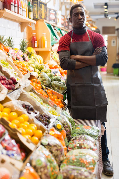 istock Confident salesman of fruit and vegetable store 1285335835