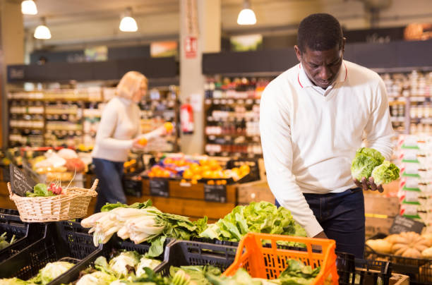 istock Man buying vegetables in supermarket 1285335904