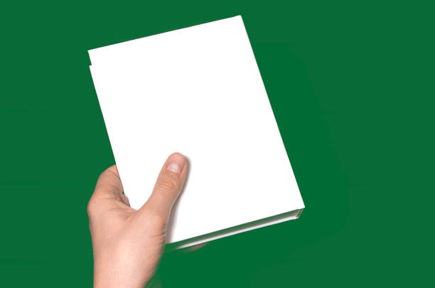 istock A mock-up of a white closed book with a place for text in a hand 1285337787