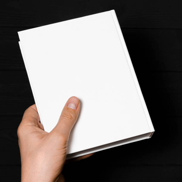 istock A mock-up of a white closed book with a place for text in a hand 1285337798