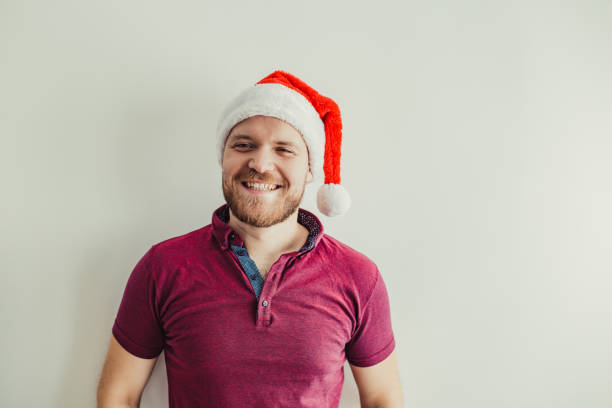 Free Stock Photo of Young guy in a sweater and a Santa hat | Download ...