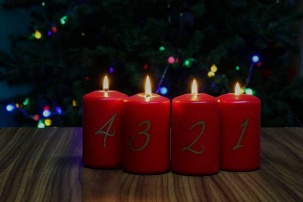 istock Red Advent candles stand on a wooden floor 1285338559