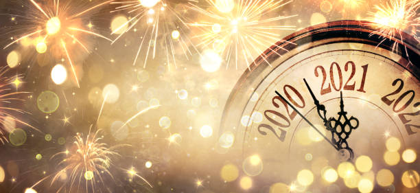 Countdown To Midnight - Happy New Year 2021 - Abstract Defocused Background - Clock And Fireworks Happy New Year 2021 - Countdown To Midnight - Clock And Bokeh Lights 2021 photos stock pictures, royalty-free photos & images