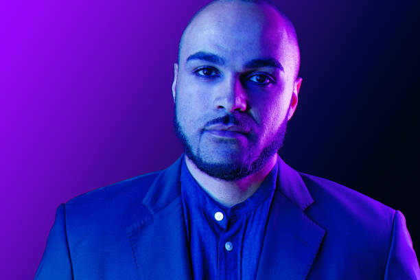 istock Serious thoughtful black guy portrait in neon light 1285341951