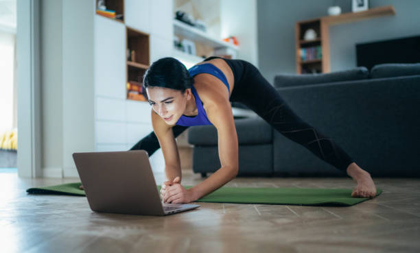 istock Woman working out at home 1285344341