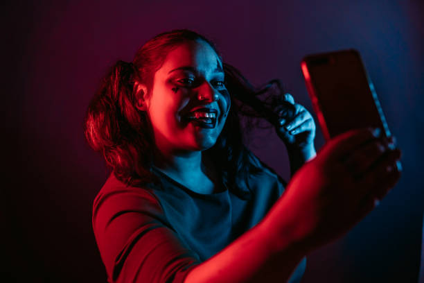istock Woman with Halloween makeup making selfie 1285344764
