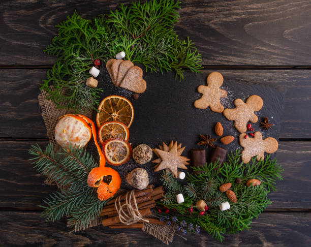 istock Christmas and New Year compositions on a black background, cones, spruce, gingerbread. Copy space, flat lay, top point 1285345923