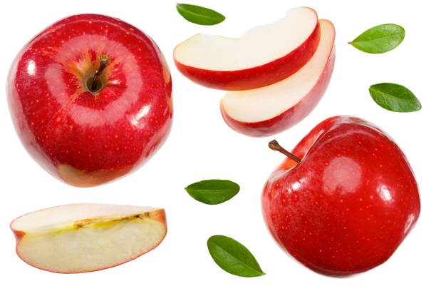 istock red apples with slices and green leaves isolated on a white background. top view 1285346794