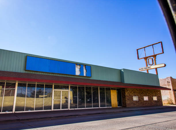 istock Abandoned Store Front Building With Damaged Signs 1285347742