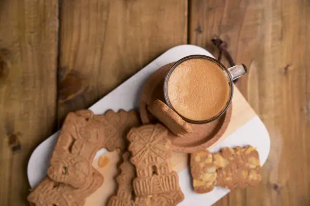 Speculaas koekjes and espresso for st. Nicolas . Dutch holiday Sinterklaas traditional sweets gingerbread cookies. 5th December holiday in the Netherlands.