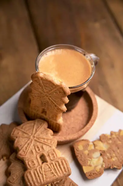 Speculaas koekjes and espresso for st. Nicolas . Dutch holiday Sinterklaas traditional sweets gingerbread cookies. 5th December holiday in the Netherlands.