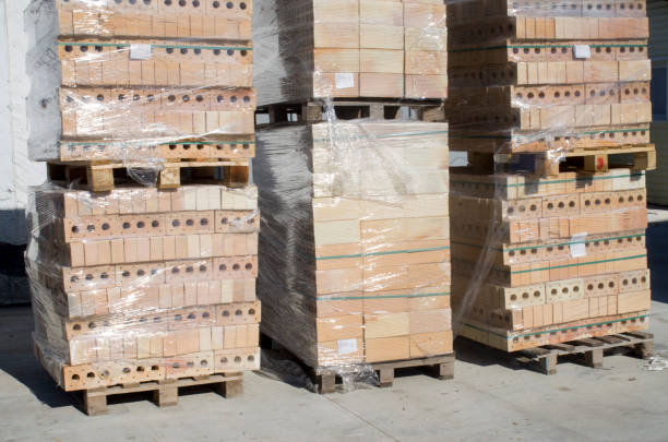 istock Pallets with new bricks in sunny day 1285351158