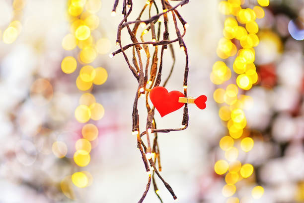 istock red heart on a background with yellow bokeh.  valentines day background 1285351380