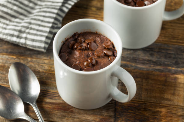 Homemade Chocolate Microwave Mug Brownie Homemade Chocolate Microwave Mug Brownie Ready to Eat mug stock pictures, royalty-free photos & images