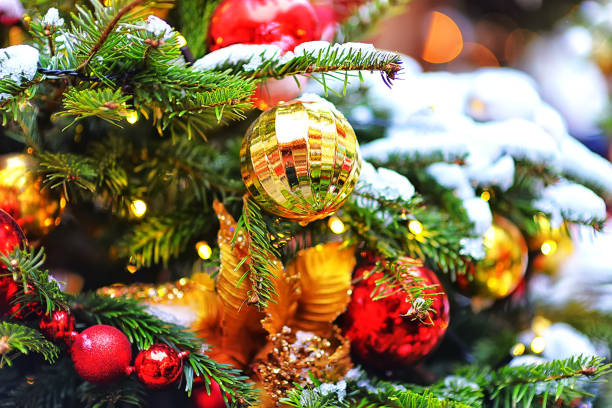 istock Christmas decorations on the branches of a Christmas tree covered with snow 1285352343