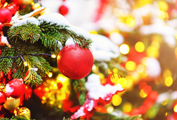 istock Christmas decorations on the branches of a Christmas tree covered with snow 1285352354