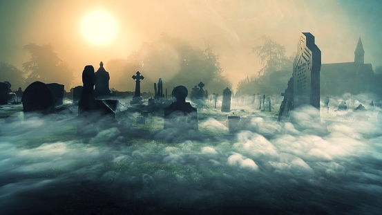 A beautiful shot cemetery with fog with old Victorian headstones snapped in the Heart of the British countryside.