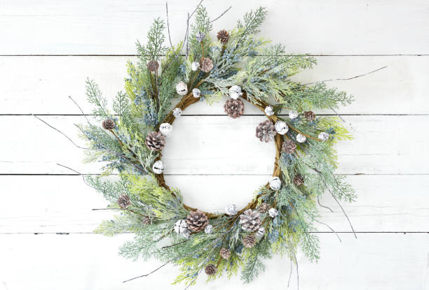 istock Christmas rustic wreath on an old white wood background 1285357168