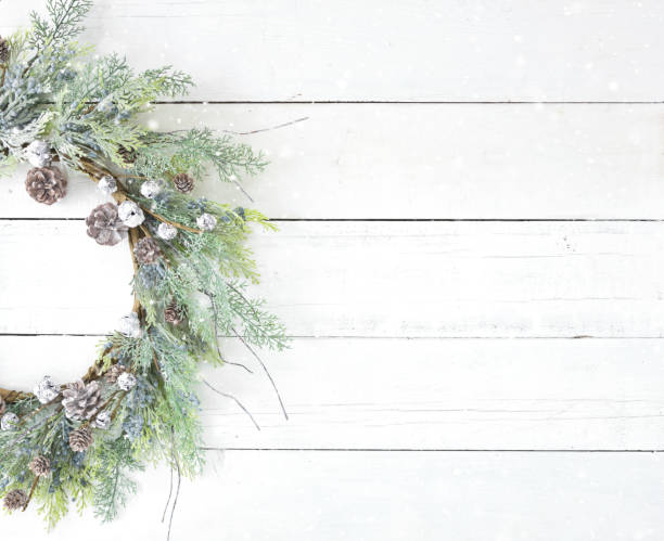 istock Christmas rustic wreath on an old white wood background 1285357178