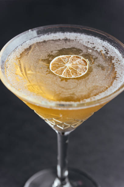 istock yellow citrus cocktail on a black background 1285358170