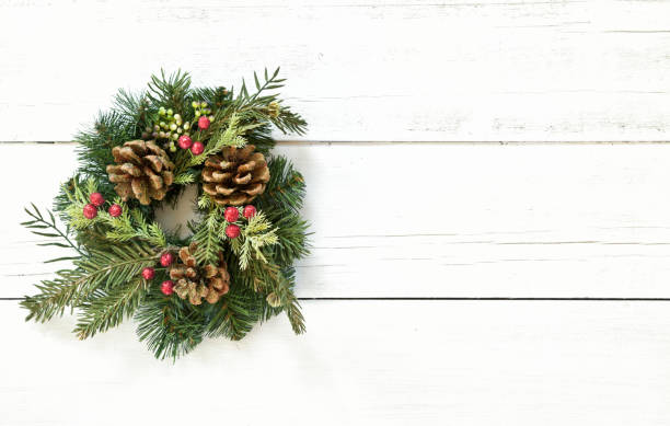 istock Christmas wreath on an old wood background 1285358651