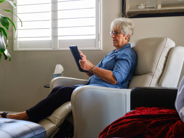 istock Senior Aged Woman Using Technology in Her Home 1285361922