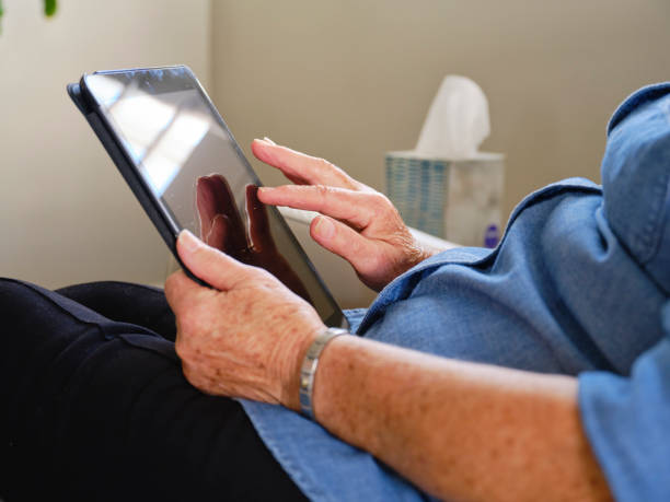 istock Senior Aged Woman Using Technology in Her Home 1285362877