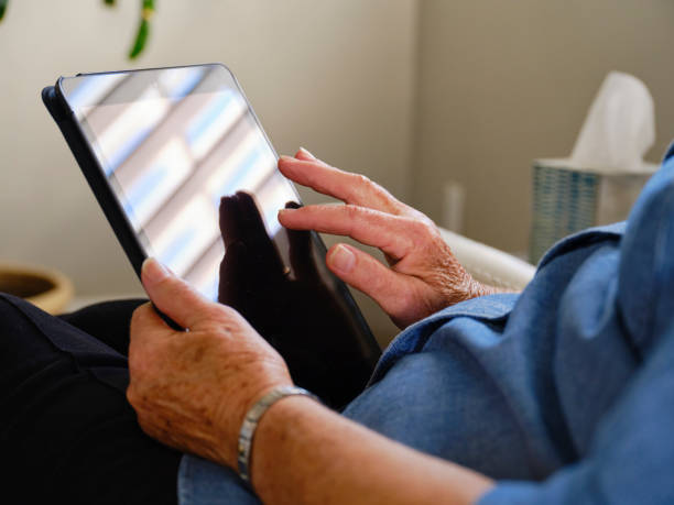 istock Senior Aged Woman Using Technology in Her Home 1285362896