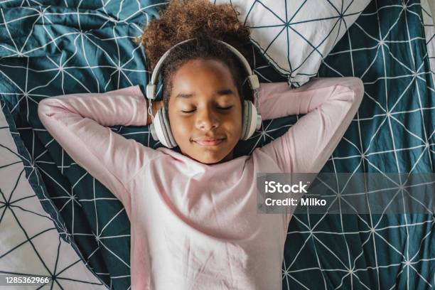 A Little African American Girl Enjoys Her Free Time At Home Stock Photo - Download Image Now