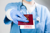 Doctor handing over immunity passport