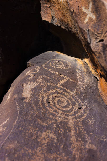 Spiral petroglyph chipped into rock at Dinosaur National Monument, Utah, U.S.A. Taken 27 May 2005.