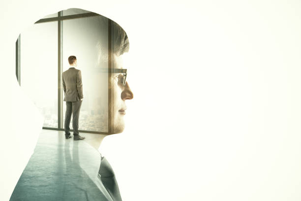 istock Businessman standing inoffice on skyscraper background. 1285366728