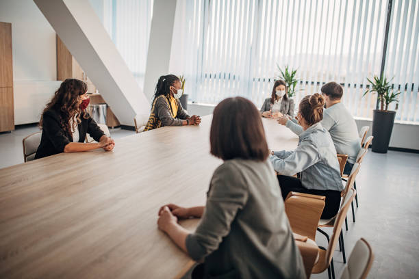 istock Group of people on a meeting in modern office 1285367569