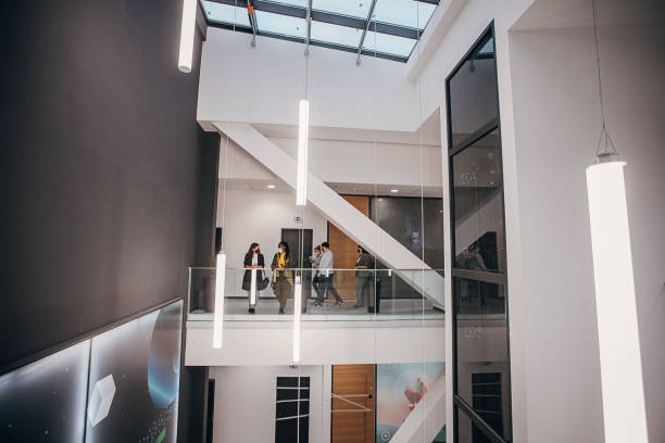 istock Group of people in modern firm building 1285369480