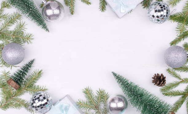 istock Frame of Christmas decorations on a white background,tree branches, cones, gifts Flatlay, CopySpace, New year 2021 1285369796