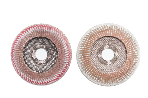 two used petal abrasive disc for grinding machine on a white background