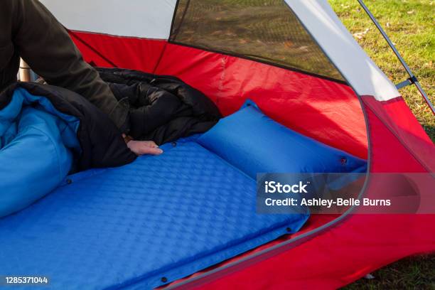A Close Up Of A Blue Camping Inflating Mattress Pad Stock Photo - Download Image Now