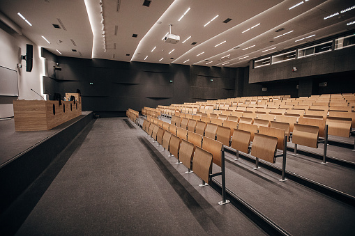 Inside of modern empty lecture hall, no people.