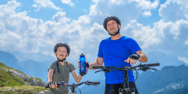 Father and son taking a break during mountain biking